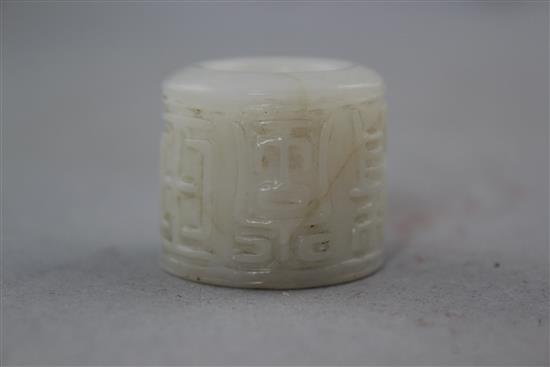 A Chinese white jade archers thumb ring, 20th century, 3.1cm. diam.